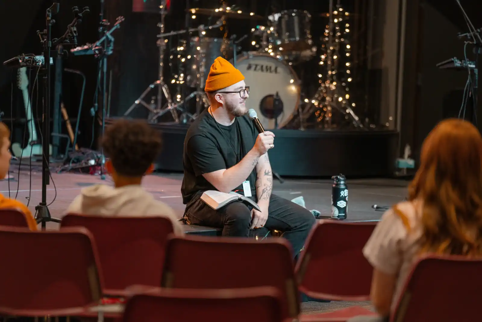 Person speaking on stage